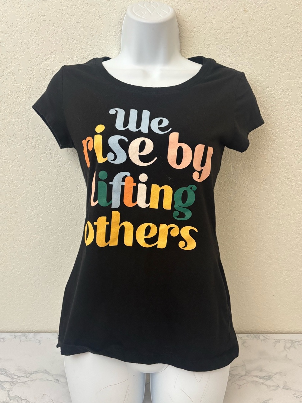 Wound Up Black Graphic Tee Juniors M 7-9 We Rise By Lifting Others Top